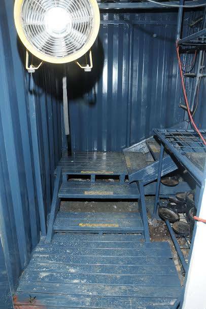 Once inside the trap door, police walked down a set of sturdy stairs and into the three shipping containers where the cannabis was allegedly grown.