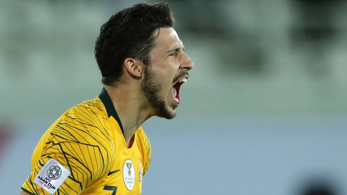 Australian forward Mathew Leckie celebrates after scoring the winning penalty.