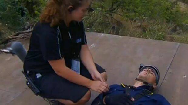 Beranrd Tomic is looked after by a medic during a tucker trial. Photo: Channel 10
