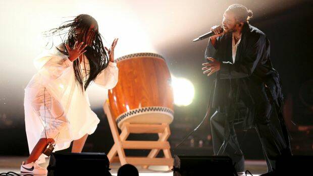 Kendrick Lamar (right) opens the 60th Grammy Awards. Photo: AP
