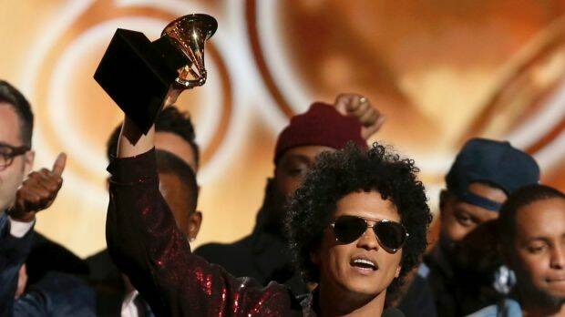 Bruno Mars accepts the award for album of the year for 24K Magic at the 60th annual Grammy Awards. Photo: AP