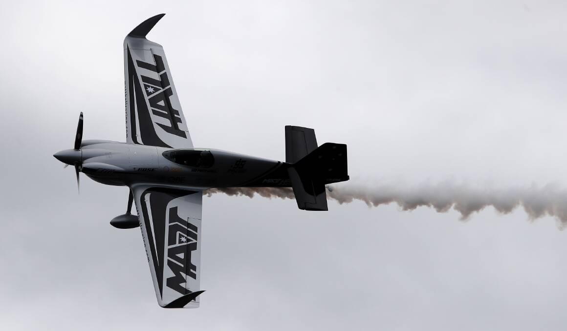 SETBACK: Reigning world champion Matt Hall flies over Lake Macquarie in April at the launch of the Hunter's first world air race. Picture: Peter Lorimer 
