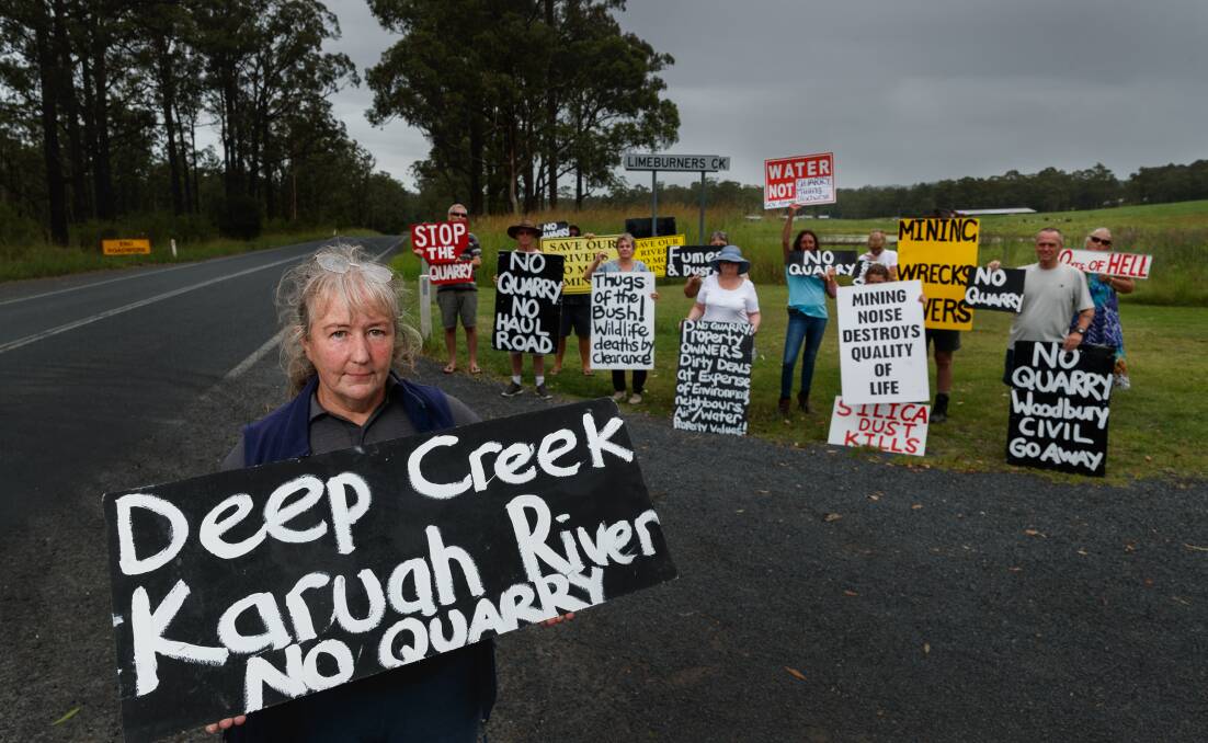 Amanda Albury and members of Ironstone Community Action Group protesting on the Bucketts Way in January 2022. Picture by Max Mason-Hubers. 