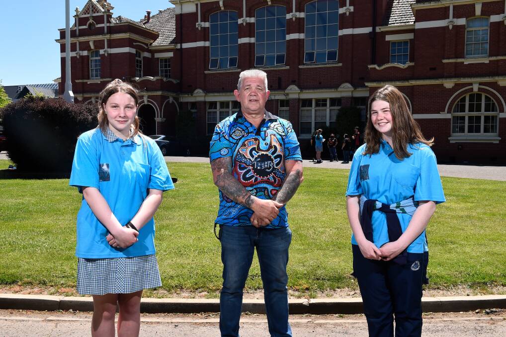 PROUD: Ballarat High School Indigenous students Alex Grant and Lillian Torney took part in the school's first NAIDOC Week ceremony with Ballarat and District Aboriginal Cooperative's Robert Watts. Picture: Adam Trafford