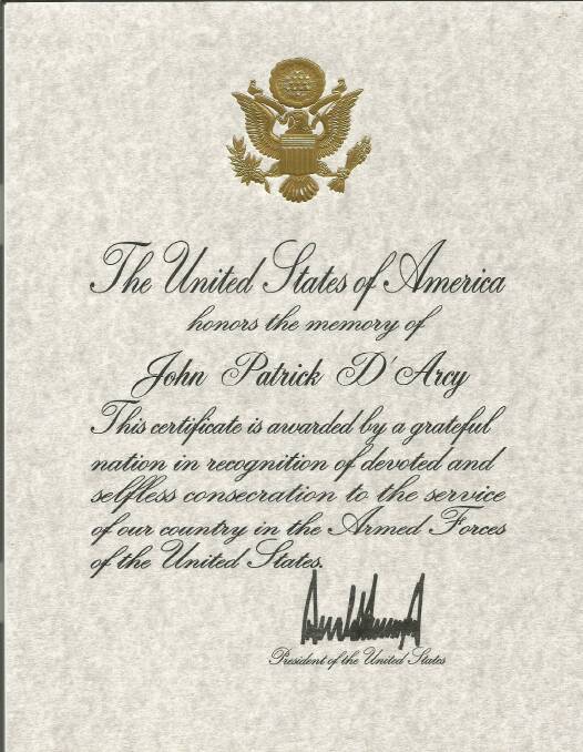 The certificate of recognition for John D'Arcy signed by then president Donald Trump. 