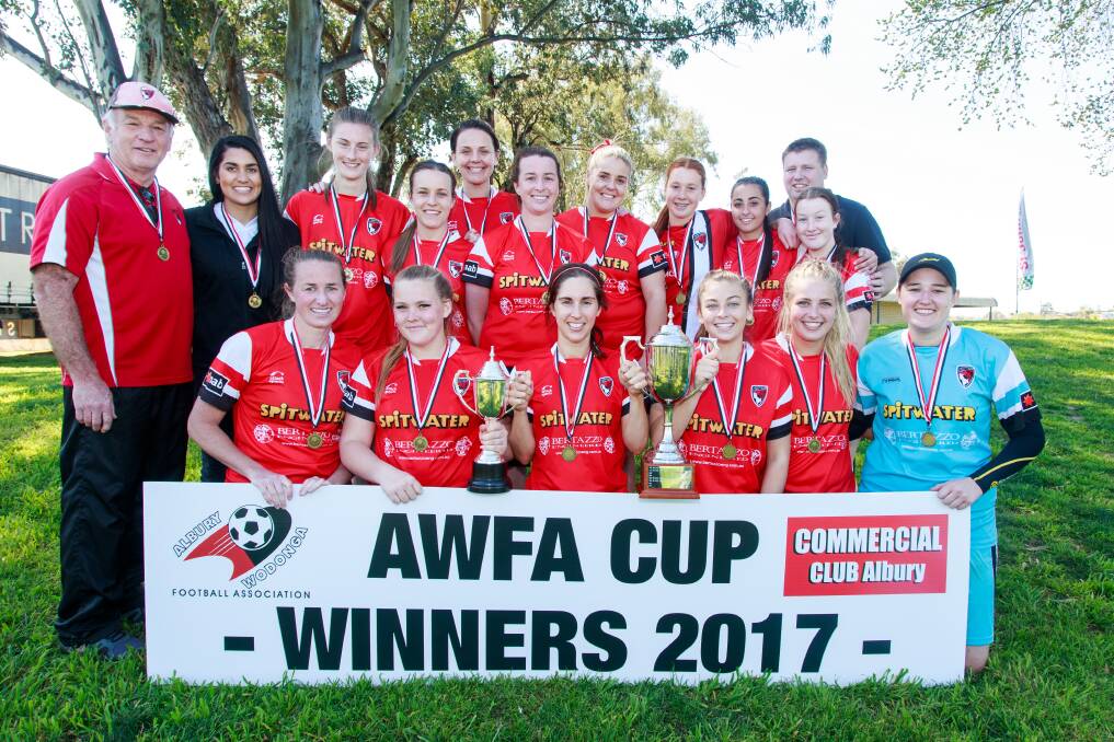 Boomers celebrate after winning the 2017 AWFA Cup final.