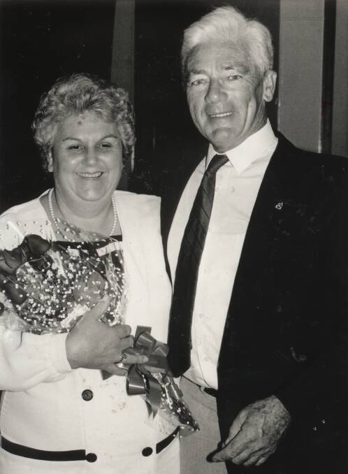 In the beginning: An early photo of founding secretary of Wingham Beef Week Pam Holmes being presented with flowers by founding president Eric Richardson.