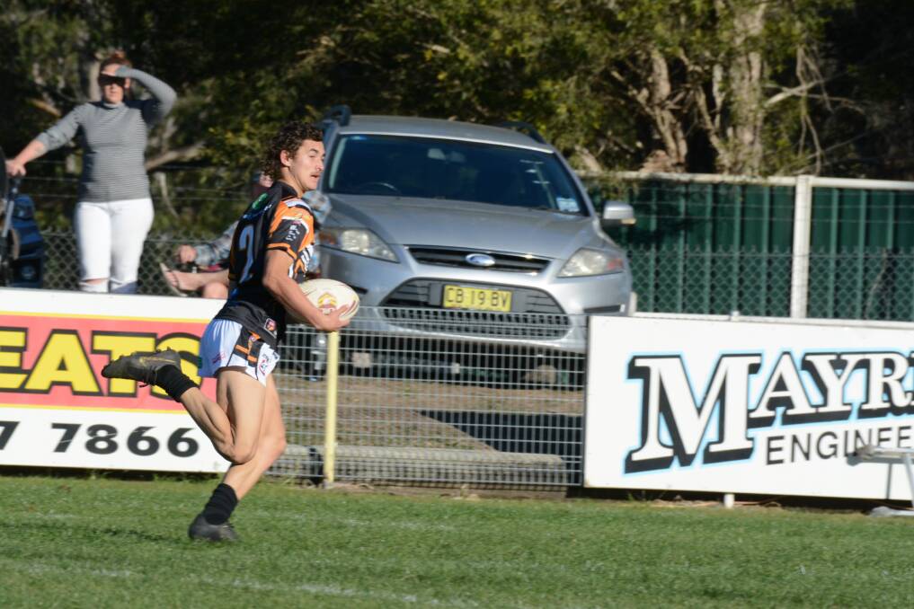 Wingham under 18 player JJ Gibson races clear of the defence during a match last season. The Tigers 18s will play in the Group Three Junior League this year.