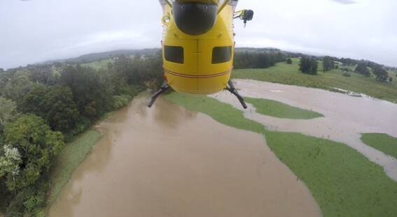 The Westpac Rescue Helicopter was dispatched to a property near Wingham to rescue a woman trapped by flood waters. Photo: @Lifesaverhelo