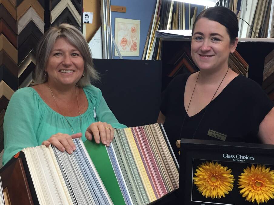 Friendly professionals: Fiona Boscheinen and Melanie Harper of Pearl Bay Custom Framing. Customers travel from all over the Mid North Coast to have their pictures custom framed in the friendly Laurieton store.