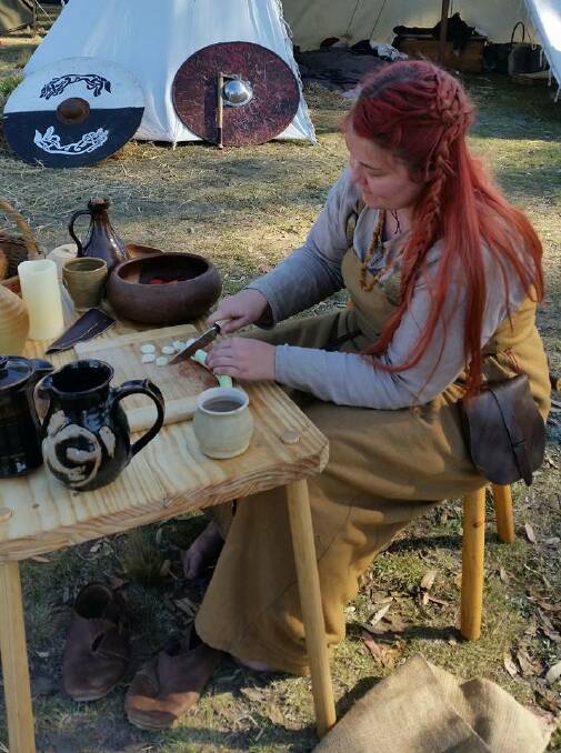 Rachel Archinal known as Runa Hundadottir, preparing some Viking food.