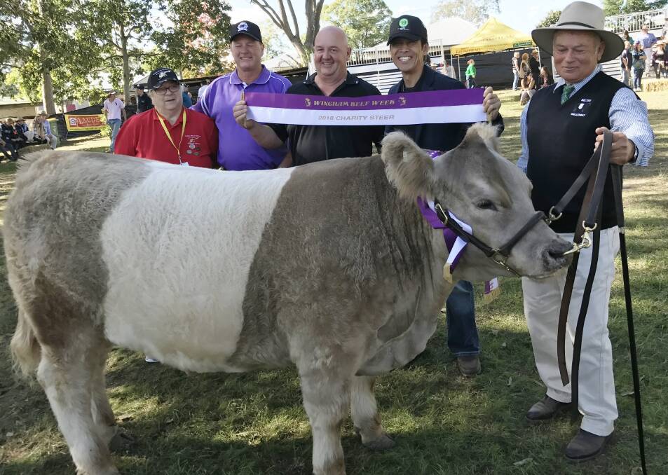 Betty Mayers (Westpac Rescue Helicopter Service), Chris Black (Wingham Beef Exports), Andrew Triance and Seiji Inatomi (NH Foods Australia Pty Ltd) with 
Merv Presland and the charity steer.