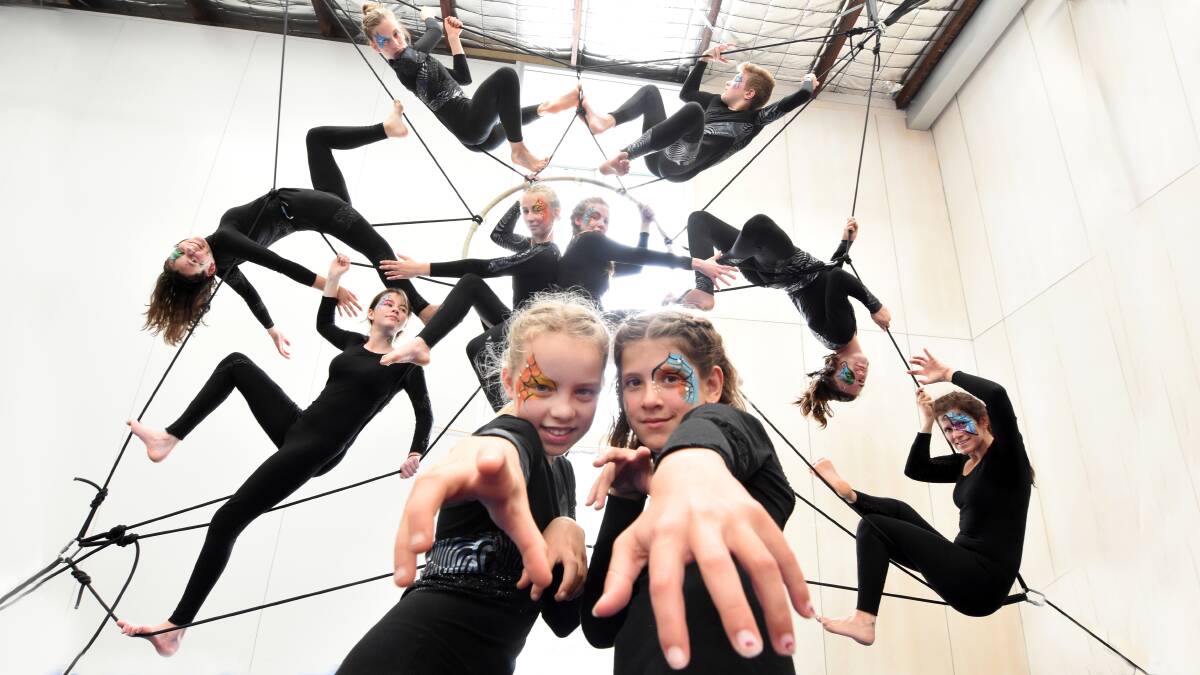 Rehearsal: Ruby Warner and Isabella Rusca with their fellow A Touch of the Brush aerial artists during rehearsals at the Circartus studio. The giant 'spider's web' will soon to be installed in Mick Tuck Reserve. Photo Scott Calvin