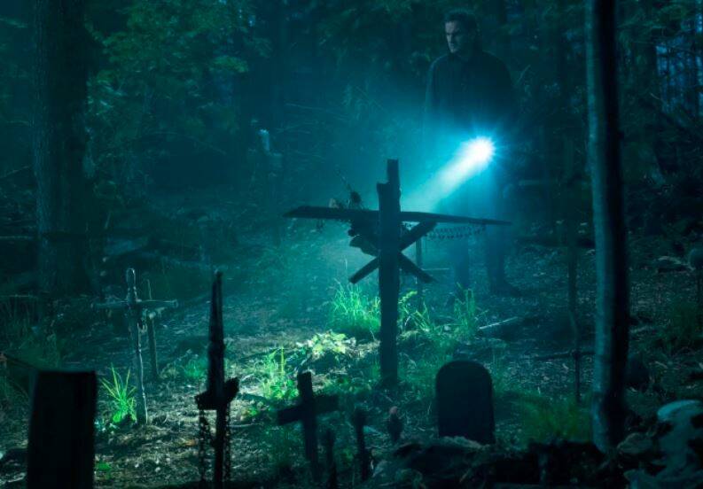 Supernatural: Jason Clarke as Louis investigates the burial ground in Pet Sematary. Rated MA15+. Photo: Kerry Hayes. 