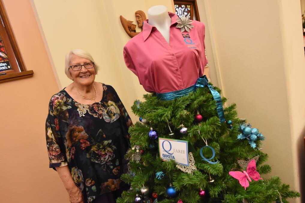 Jeanette Holland with the Quota International of Taree contribution to the Blue Cross Festival of Christmas Trees.