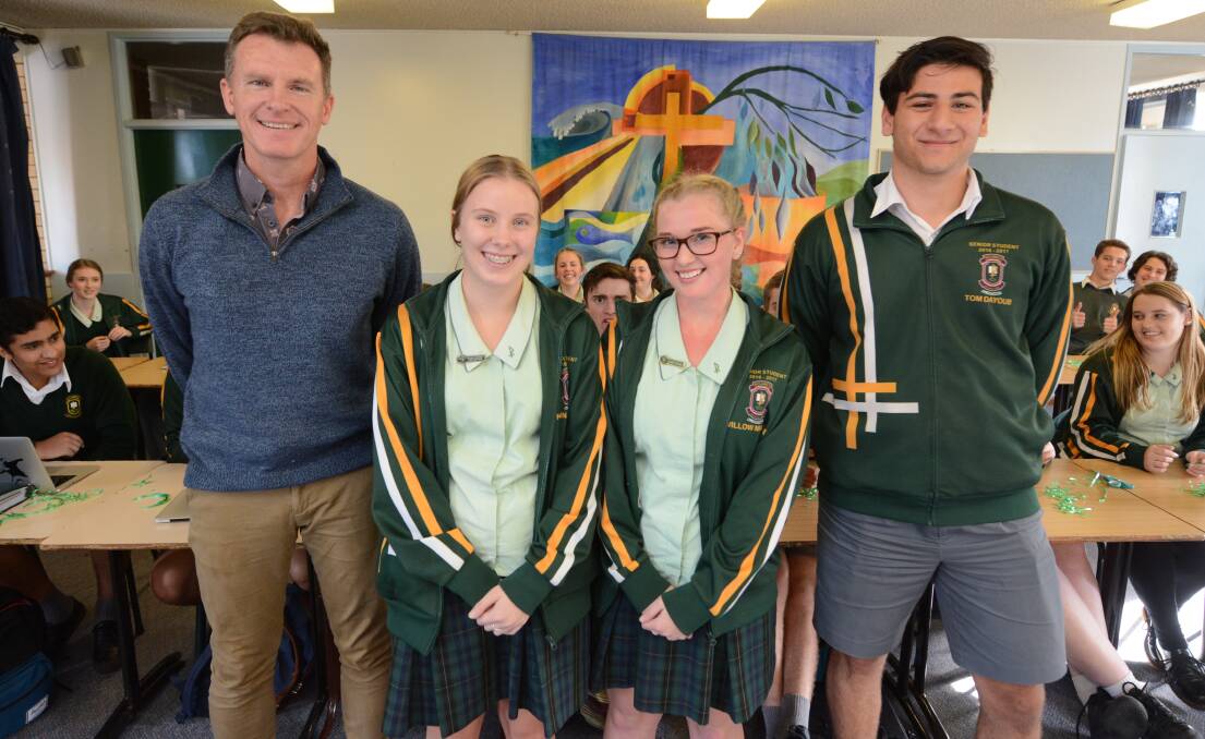 Advocates for greater community awareness of refugee issues: St Clare's High School human rights group co-ordinator, Phil Chalmers and students Hannah Lewis, Willow Mackay and Thomas Dayoub.