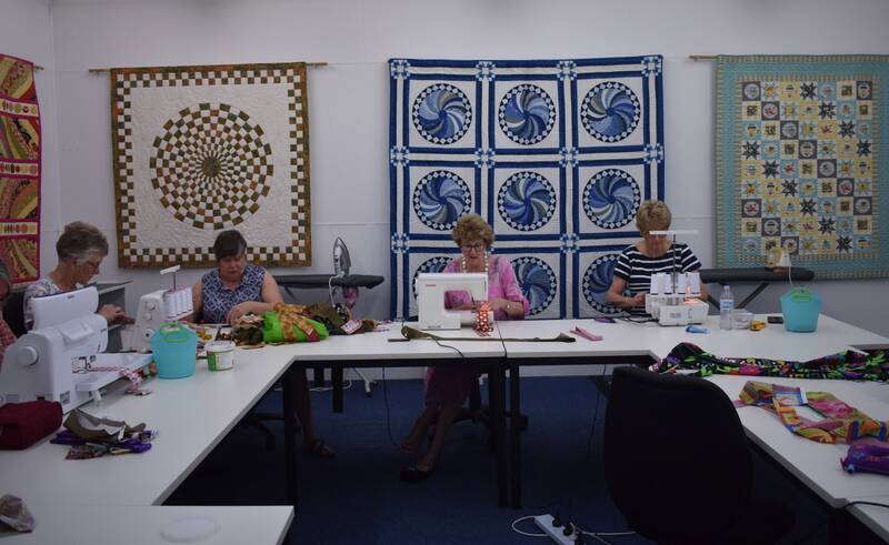 Volunteers positioned themselves around the large sewing tables in Country Pickin's, and worked all day to create the cool ties.