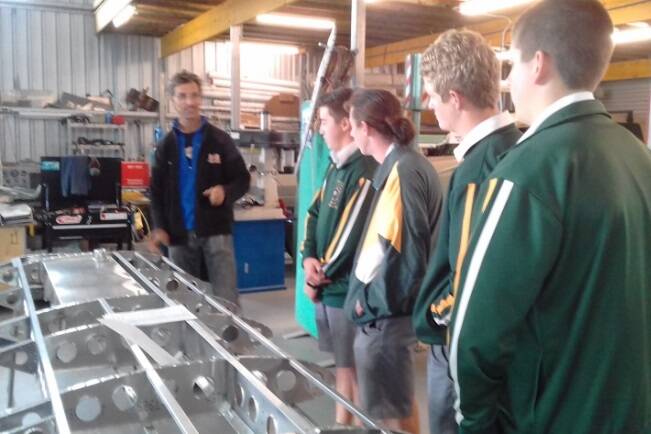 Australian Aircraft Kits owner Ole Hartmann explains aspects of wing design to St Clare's High School year 12 engineering studies students.