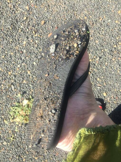 The road surface lifted and stuck to tyres and the thongs of local residents.