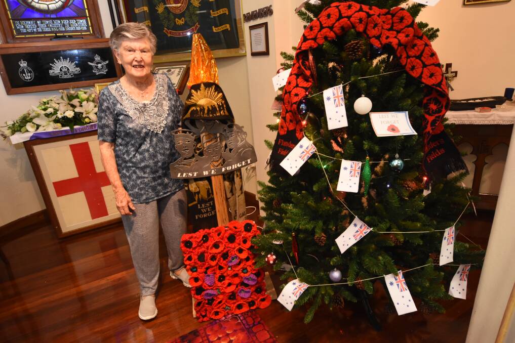Margaret Blyth with a Christmas tree tribute to the men and women who served in military conflicts. Lest we forget.