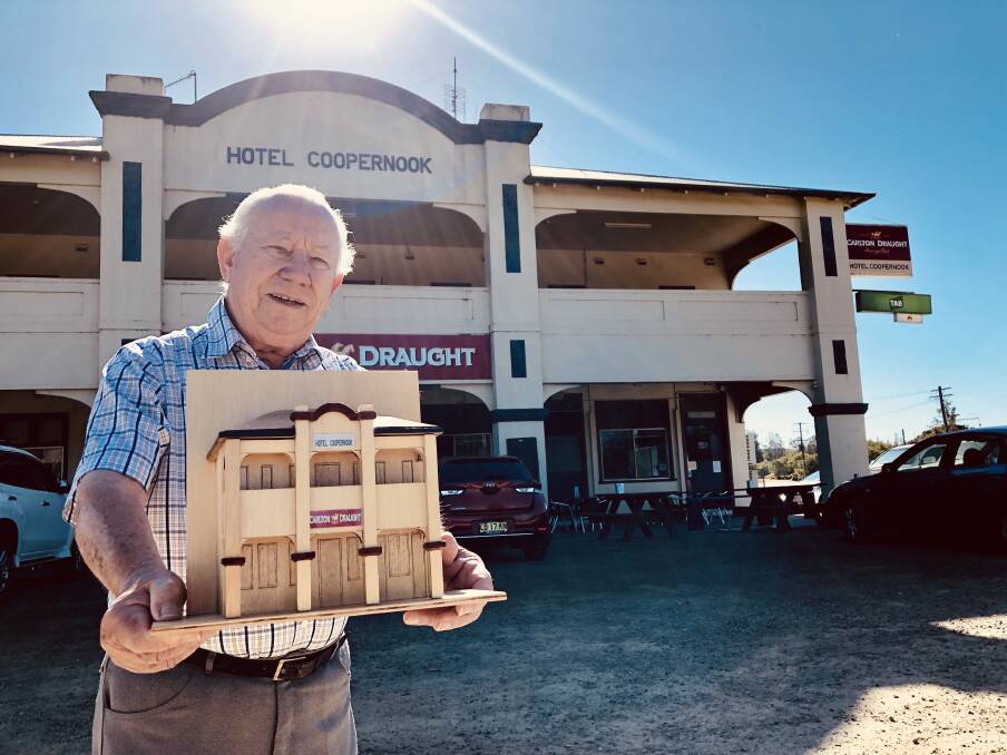 Chris Pearson proudly presents the mini pub money box he made to collect donations for the Coopernook Carols in the Park fireworks. Photo: Ainslee Dennis.
