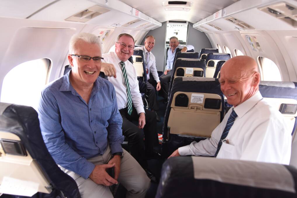 FlyPelican is set to soar into Taree skies and celebrating the new venture is (from left front) MidCoast Council's general manager Glenn Handford, mayor David West, member for Myall Lakes Stephen Bromhead, FlyPelican CEO Paul Graham and council's director, community spaces and services, Paul De Szell.