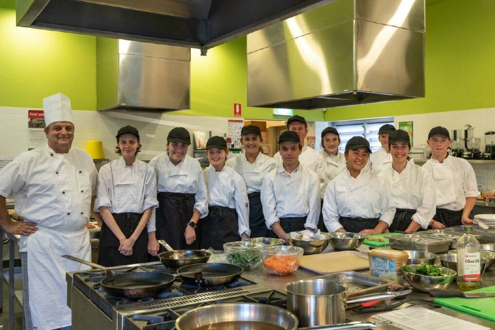 Top team: St Clare's hospitality teacher Laurent Gonfond with the students who worked hard to deliver a three course meal to 20 people. From left is Gabrielle Eggins, Maddison Chippett, Lani Bedforth, Megan Walton, Declan Lambert, Kallen De-Giovanni, Cassandra Crittenden, Widdina Tuy, Lucy-Belle Sheather, Carissa Davidson and Joshua Tiedeman. Photo: Callum Howard.