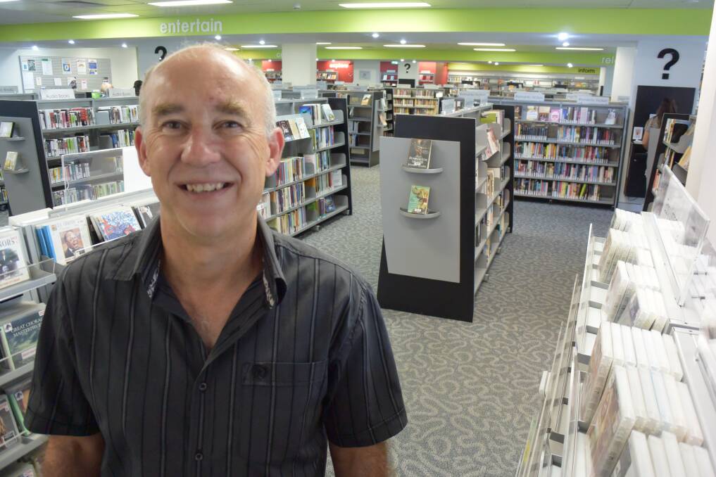 Chris Jones, MidCoast Council's manager of libraries is urging people to have a look at the great choice of popular magazines through the free online library database. Photo: Ainslee Dennis.