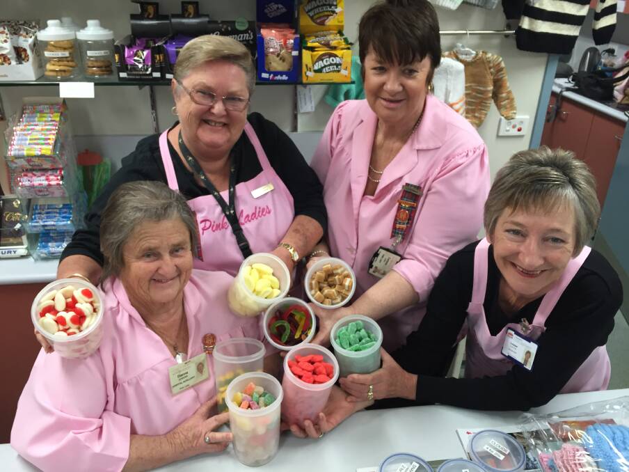 Pick your mix: Manning Hospital Pink Ladies (from left) Dianne Jenkins, Betty Grant, Corinne Lang and Louise Burton will happily help you to create the perfect bag of mixed lollies. Photo: Ainslee Dennis.