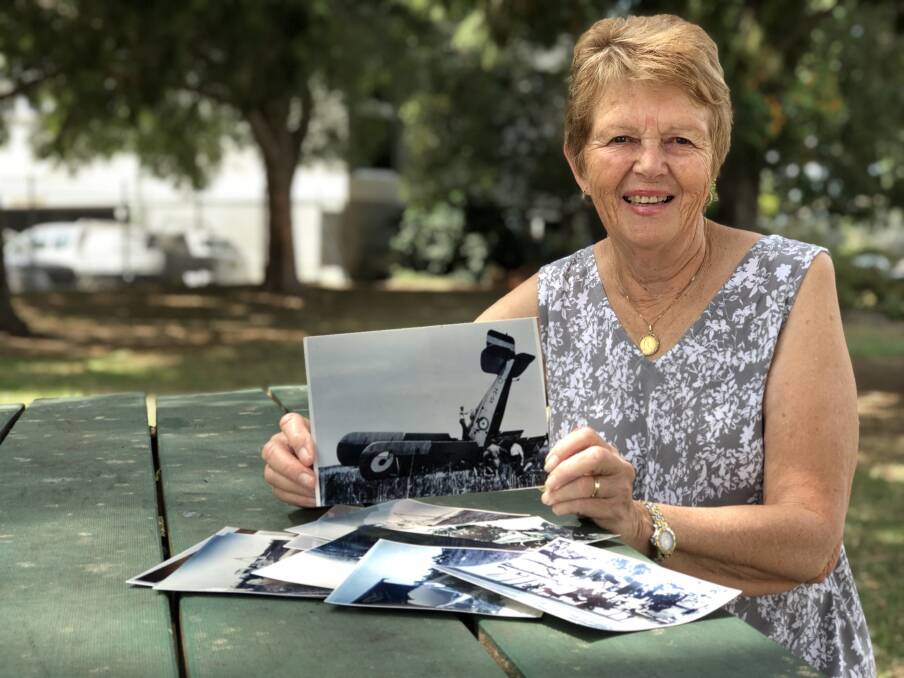 Rhonda Blanch with the collection of 12 photos that reveal the plane crash in swamp area near Harrington. Photo: Ainslee Dennis.