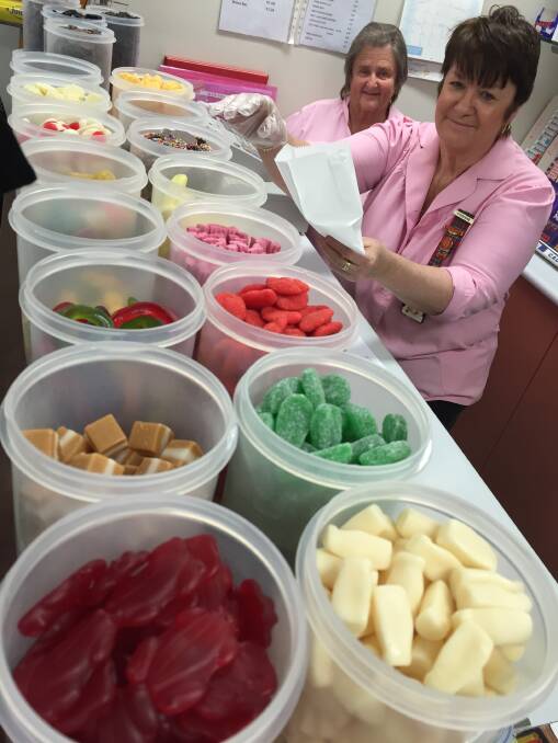 Pink Ladies president Corinne Lang and Dianne Jenkins happily help you to pick your perfect mix of lollies at Manning Hospital.