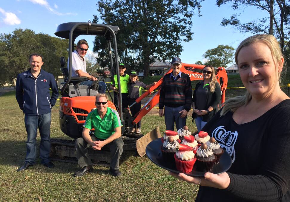 Community kindness: Meet the people who quickly acted to help Taree Community Garden to prepare for its relocation (from left) Justin Hayes, Taree PCYC club manager, Peter Fowler of Manning Valley Pumps and Irrigation (seated), Tony Carolan of HQ Mini Diggers, young Liam and Shaniese Scicluna, Bill Dennis of Friends of Browns Creek-Crook Creek, Julie Scicluna of M & J Detailed Excavation and Nicole Barber of The Hooting Owl Coffee House who will provide cupcakes and lunch for volunteers who help on Saturday.