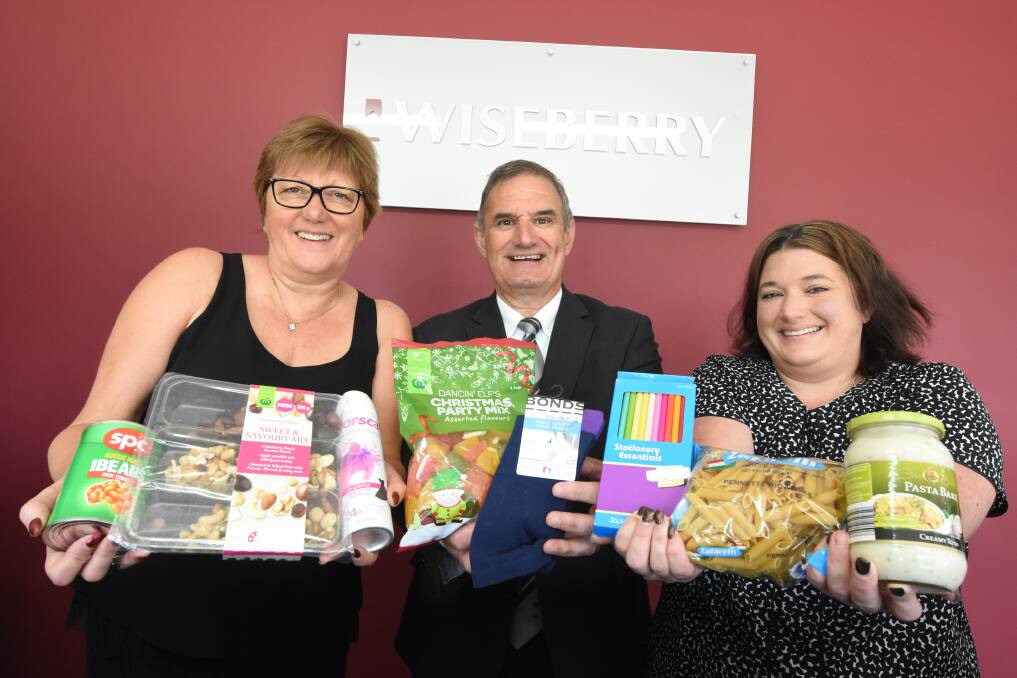 Alister, Lesley and Dawn Currie of Wiseberry Taree urge people to shop for a family in need this Christmas and donate to the Wiseberry Christmas Appeal. Photo: Scott Calvin.