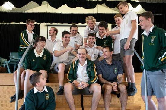 Year 12 student Andrew Jennison (centre) allowed friends to shave a bald spot on the top of his head to raise funds in the World's Greatest Shave event.