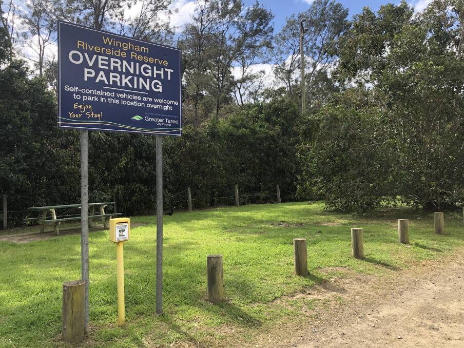 Signage erected by former local government council, Greater Taree City Council, says 'self-contained vehicles are welcome to park in this location overnight.' Photo: Ainslee Dennis.