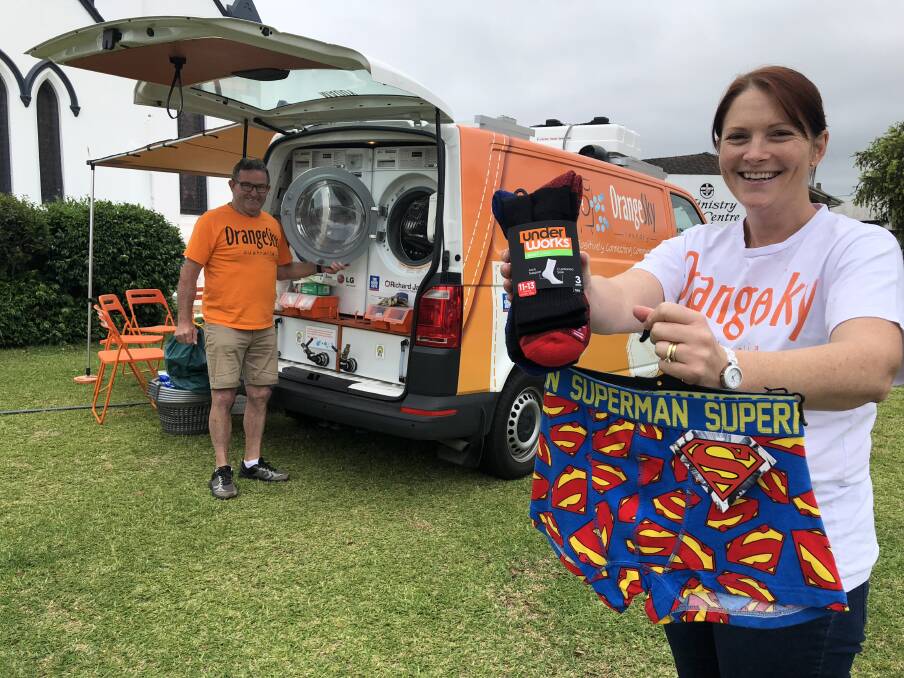 Donations: Orange Sky Laundry service manager, Alison Neale hopes the Taree community will back the socks and undies donation drive. Alison and volunteer, Graham, are part of a team who provide a free laundry service in Taree for homeless people every Monday and Friday. Photo: Ainslee Dennis.