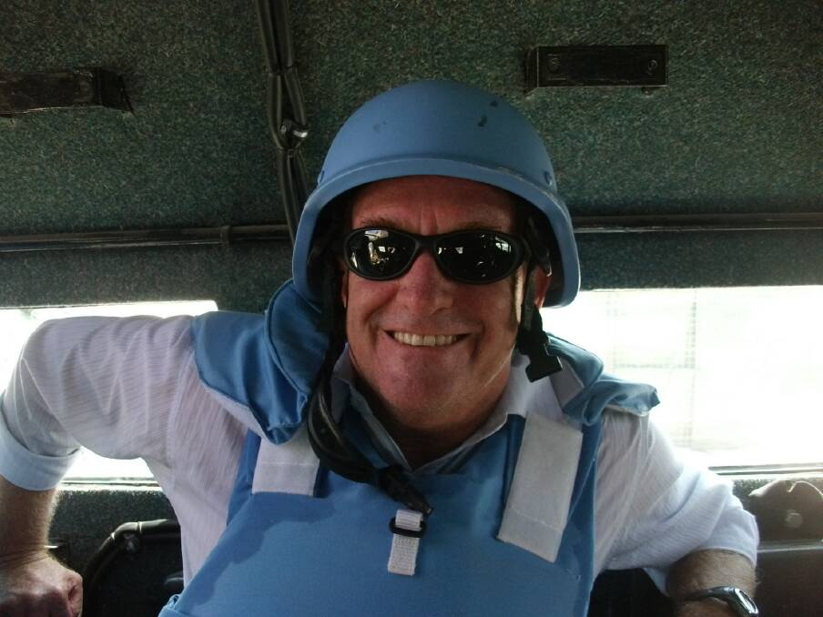 Greg Blaze OAM in Mogadishu dressed in United Nations personal protective equipment - a helmet and a bullet proof vest that weighed around 10 kilograms.