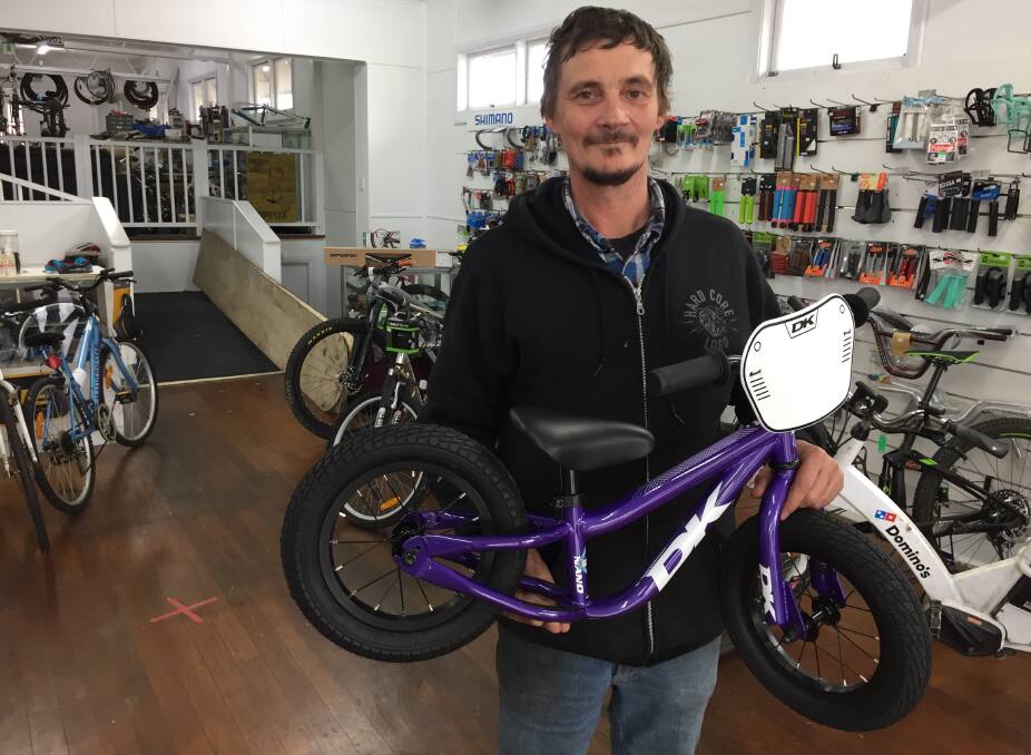 Dean Grace of Deano's Bicycle Repairs with the only new bike he has left in his store.