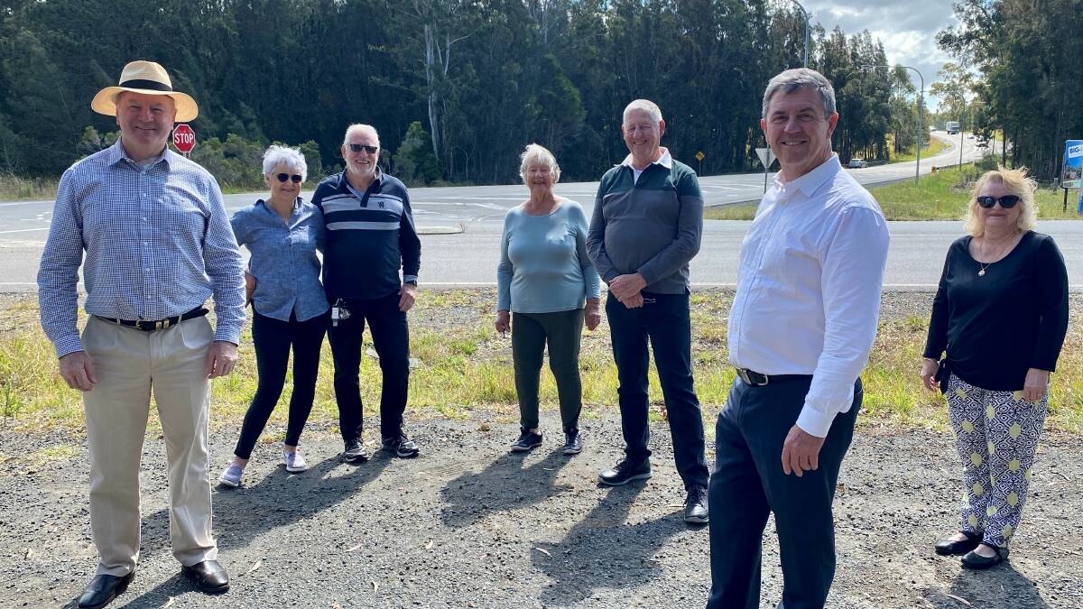 Local members Stephen Bromhead and David Gillespie with Hallidays Point community members at the intersection of The Lakes Way and Black Head Road.