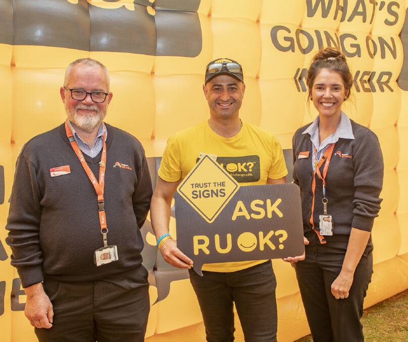 Mostapha Kourouche (centre) says R U OK? Day is a call to action for everyone. Photo courtesy of Ben Houston.
