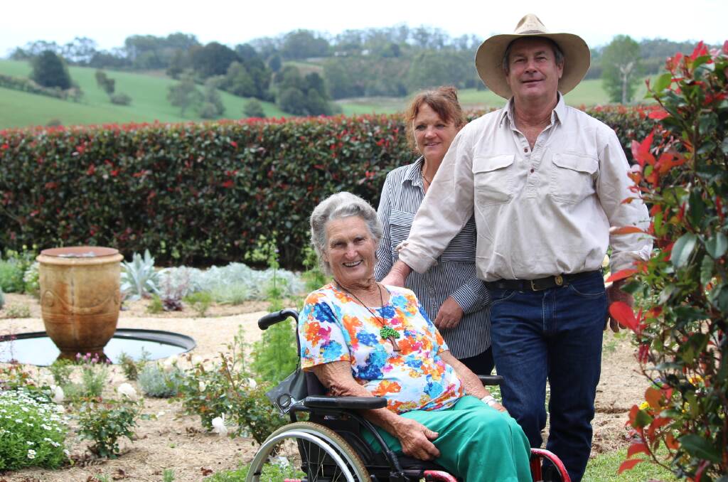 Family affair: Peggy Lyon with Richard and Robyn Lyon in the family's beautiful rose garden.