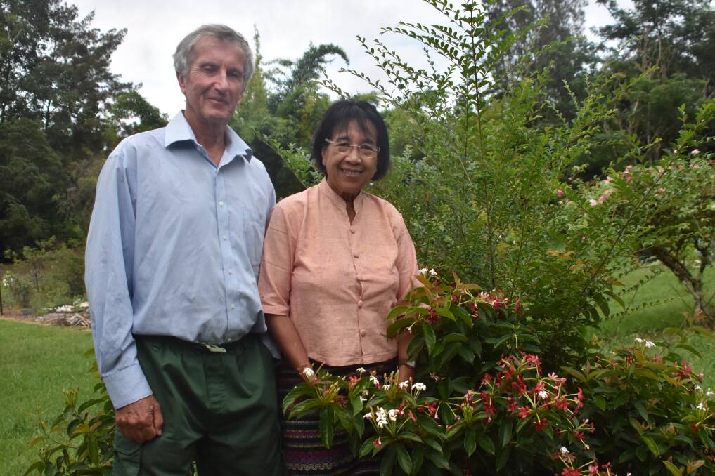 LISTENING FOR NEWS: Tin Hta Nu and Ian Oxenford in their garden, awaiting news from Myanmar.