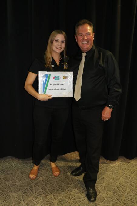 Krystal Bee, nee Lema, accepting a certificate of recognition for her contributions to the Pinjarra Football and Netball Club. Photo: Caitlin Magill. 
