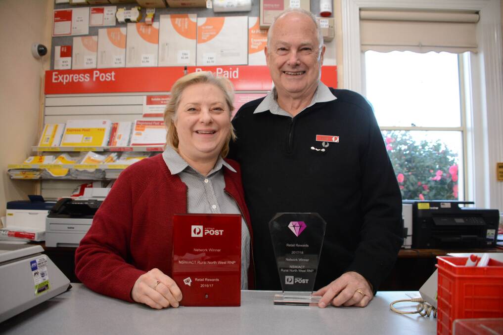 Rewarded: Craig and Susan Ryde of Cundletown Post Office with their Australia Post Licencee Awards which recognise the couple's excellent customer service and contribution to the community. Picture by Scott Calvin.