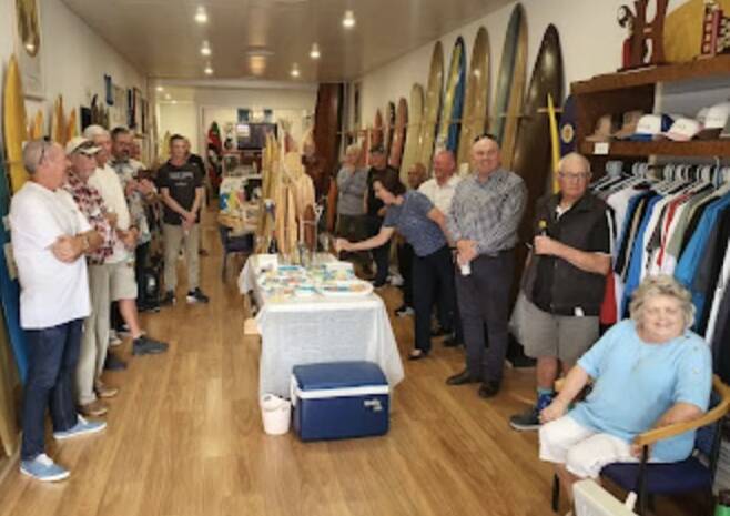Guests attend the official opening of the Port Macquarie Surfing History Association's Horton Street pop-up shop. Photo by Adam Roh