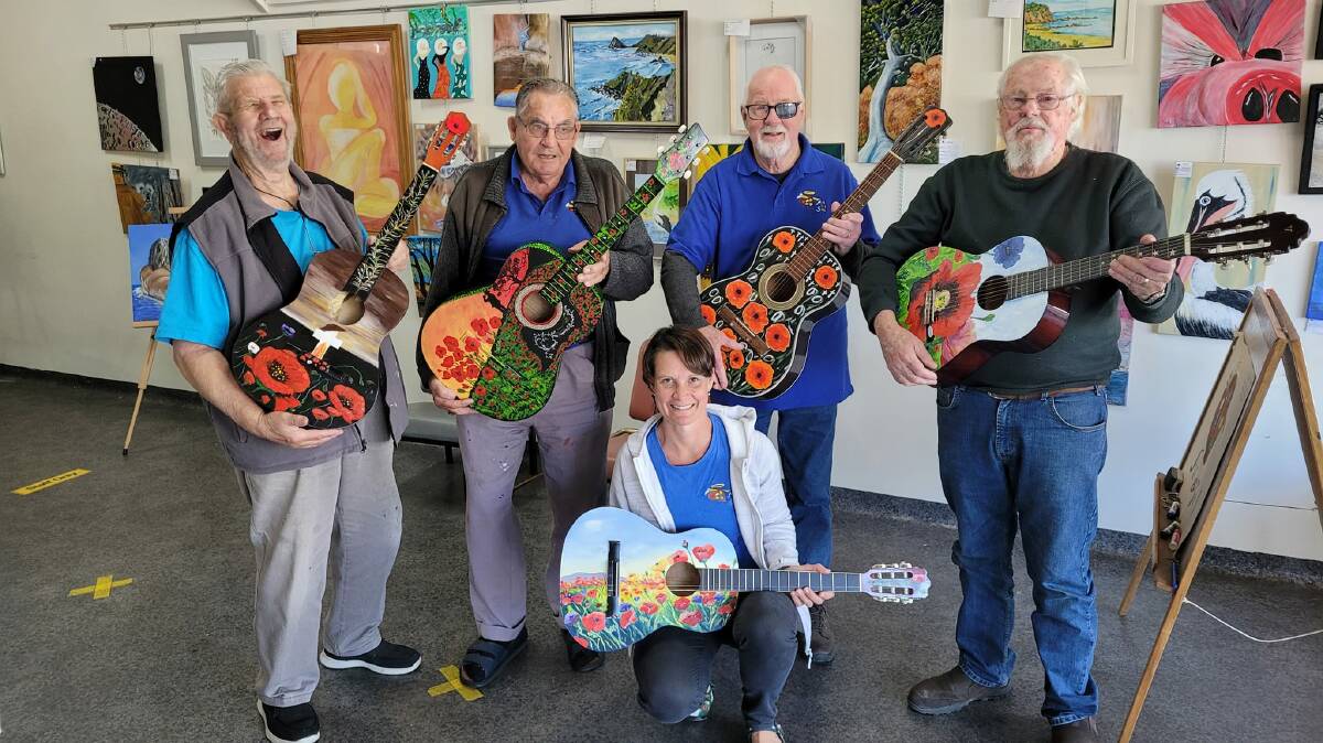 Jillian Oliver (front) with Ron Irwin, Uncle Ray Hurst, Ron Hindmarsh and Damien Doyle, with the guitars they painted for Guitars for Vets. Picture supplied.