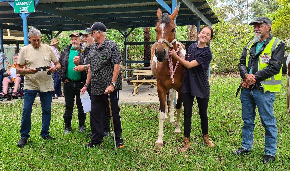 Club members meeting Dolly the horse. Photo supplied