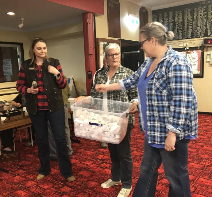 CBA branch manager Jaimie Mathiske, Maureen Koppen and Ruth Lovell drawing the raffle at Wingham Bowling Club. Picture: submitted