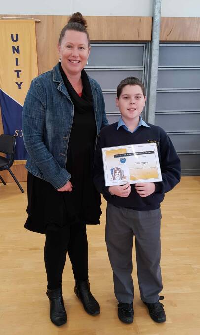 Tallin presented with the St Mary MacKillop award by St Joseph's Primary School Wingham principal Mrs Emma Timmins. Photo: submitted
