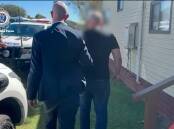 Man being arrested in Taree for international sex crimes. Picture from NSW Police video.
